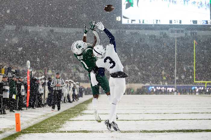Michigan State's Jayden Reed catches a touchdown pass against Penn State's Johnny Dixon. (Raj Mehta/USA Today Sports)